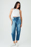 Woman wearing blue jeans and a white top on a white background